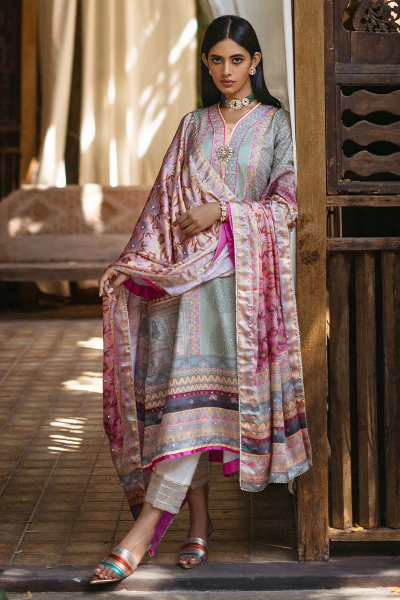 Model wearing Taffy dress from Mushq's Nirvana Silk Edit in pastel tones with intricate pink and grey patterns. Pakistani winter casual pret clothes available online in the UK.