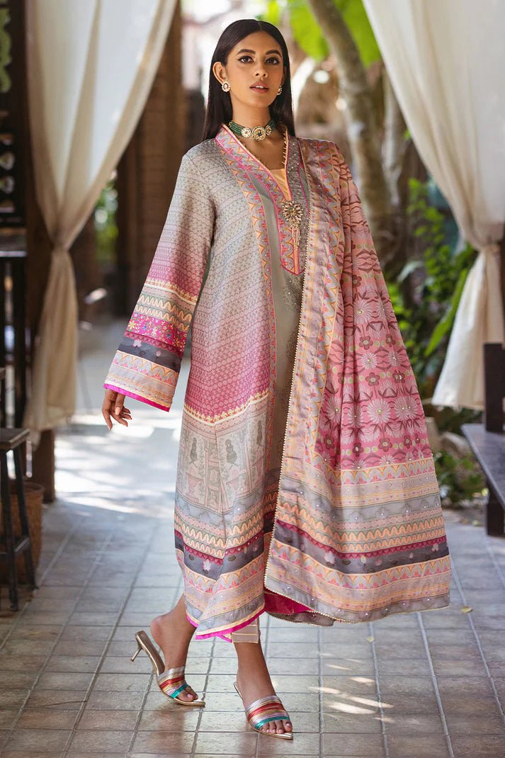 Model wearing Taffy dress from Mushq's Nirvana Silk Edit in pastel tones with intricate pink and grey patterns. Pakistani winter casual pret clothes available online in the UK.