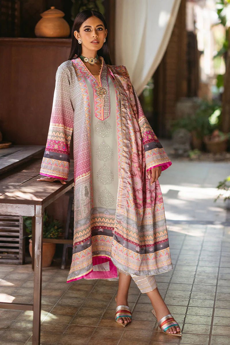 Model wearing Taffy dress from Mushq's Nirvana Silk Edit in pastel tones with intricate pink and grey patterns. Pakistani winter casual pret clothes available online in the UK.