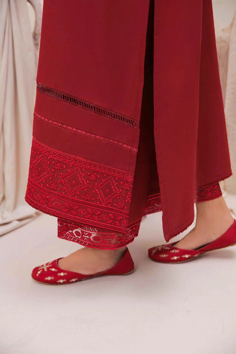 Model wearing Mushq Wisteria Winter Basic Pret '24 Red Wonder, a vibrant red dress with intricate embroidery, perfect for winter casual wear. Available for Pakistani clothes online in the UK.