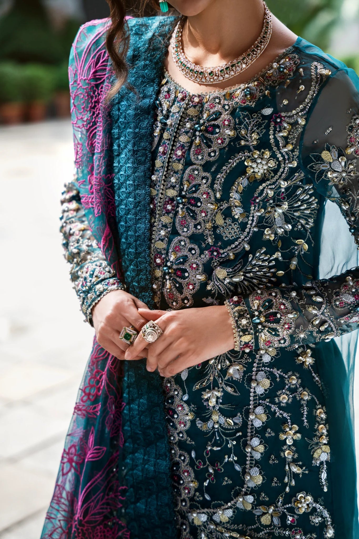 Model wearing Mysie by Tahira AROOB dress in teal, showcasing intricate embroidery and elegant design, perfect for weddings. showcasing Pakistani clothes online in the UK at Signature Labels