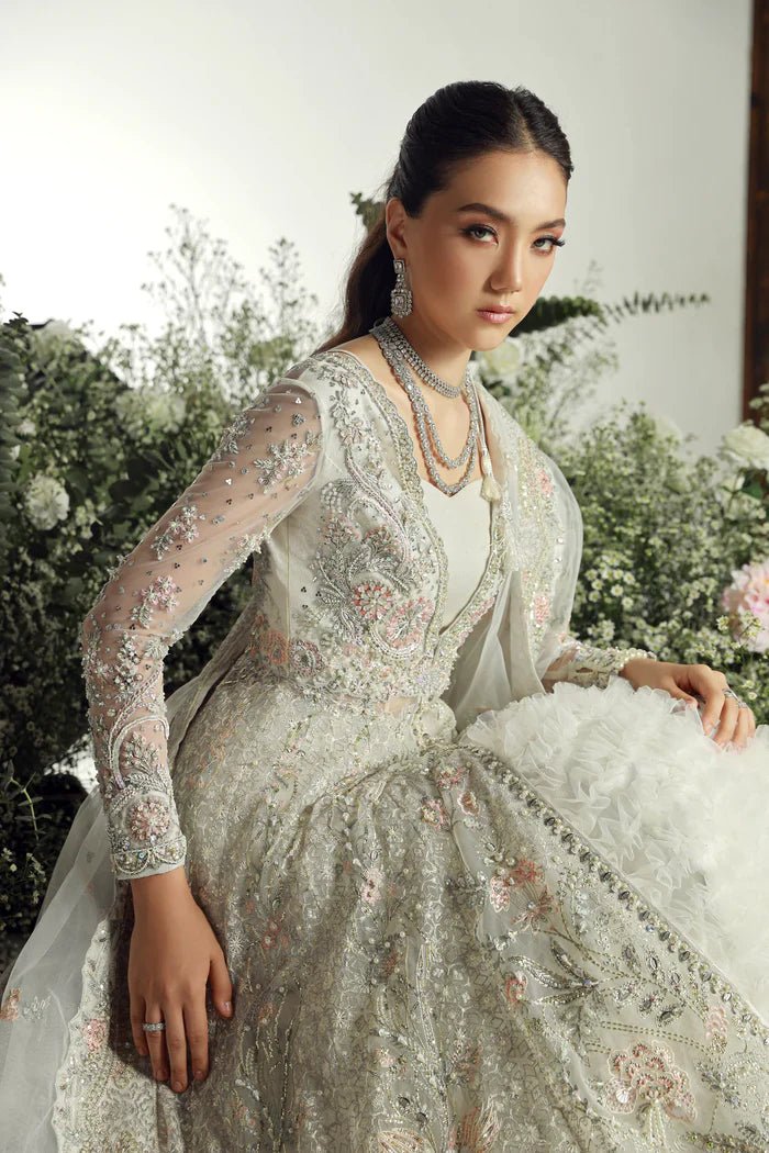 Model wearing Ruva from Mysie by Tahira's Arzu Bridals '24 collection in elegant ivory. Wedding wear, bridal, Pakistani clothes online in UK.