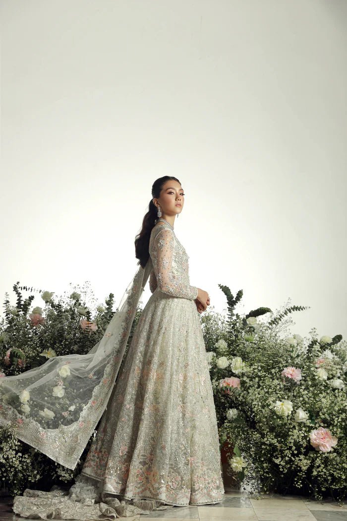 Model wearing Ruva from Mysie by Tahira's Arzu Bridals '24 collection in elegant ivory. Wedding wear, bridal, Pakistani clothes online in UK.