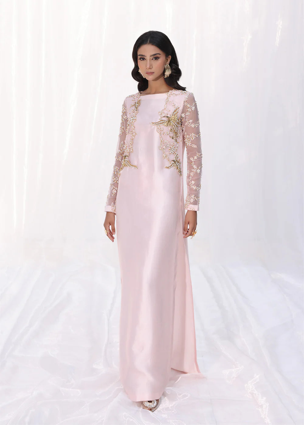 Model wearing powder pink embroidered dress with sheer sleeves and printed dupatta from Musferah Saad Moonlit Glam, Pakistani Luxury pret online in UK.