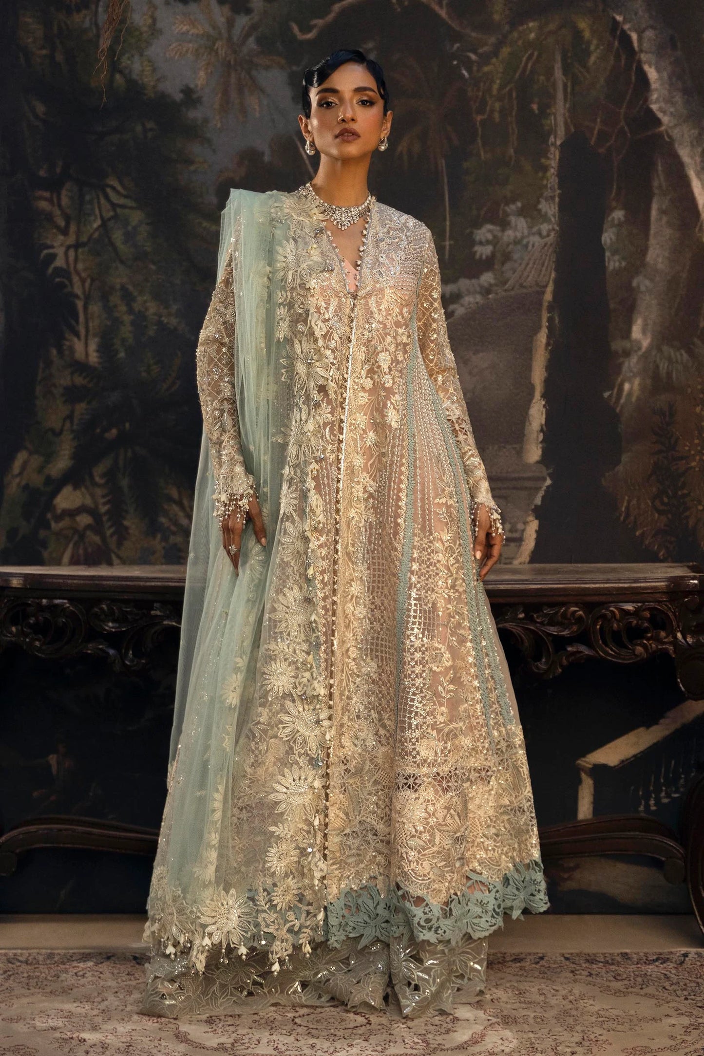Model wearing pastel gold Sana Safinaz N251-001-3CT outfit with intricate embroidery and net dupatta, Pakistani Luxury pret, Pakistani clothes online in UK.