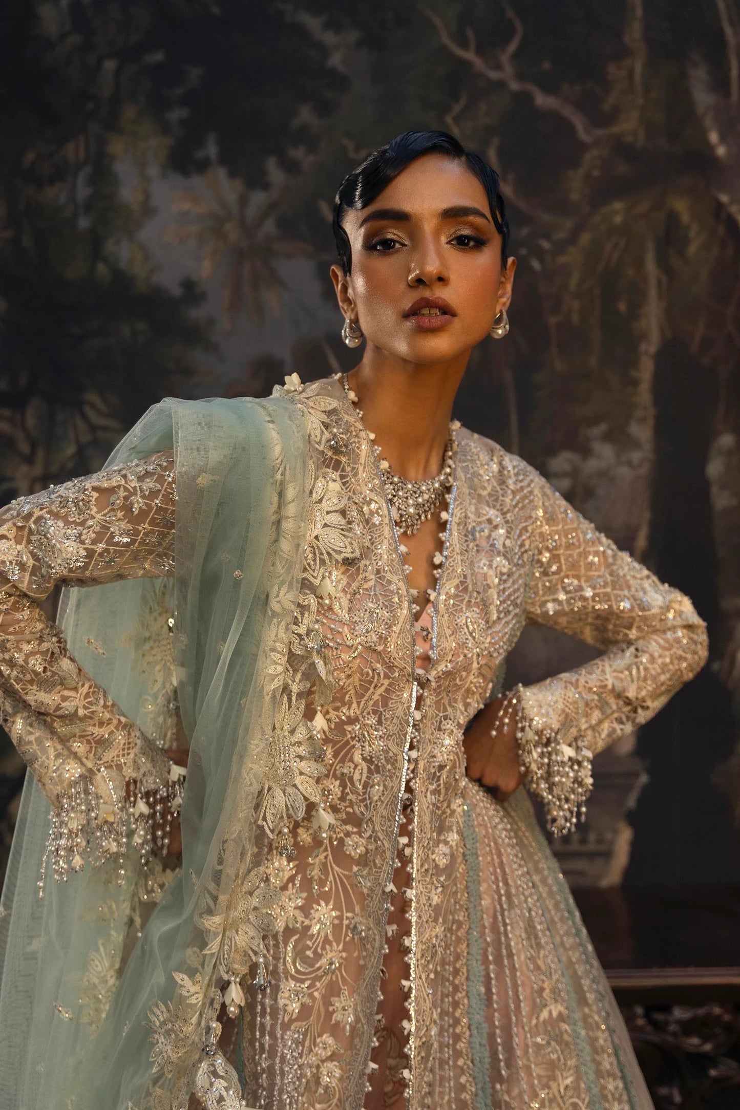 Model wearing pastel gold Sana Safinaz N251-001-3CT outfit with intricate embroidery and net dupatta, Pakistani Luxury pret, Pakistani clothes online in UK.