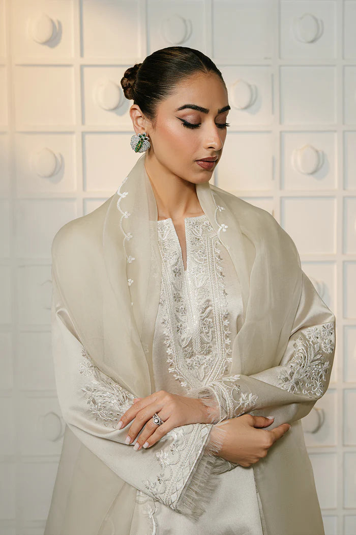 Model wearing ivory ELIYA-SREP1-01 from Saira Rizwan Luxury Lawn Eid Edit '25, perfect Pakistani luxury pret for UK desi fashion lovers.