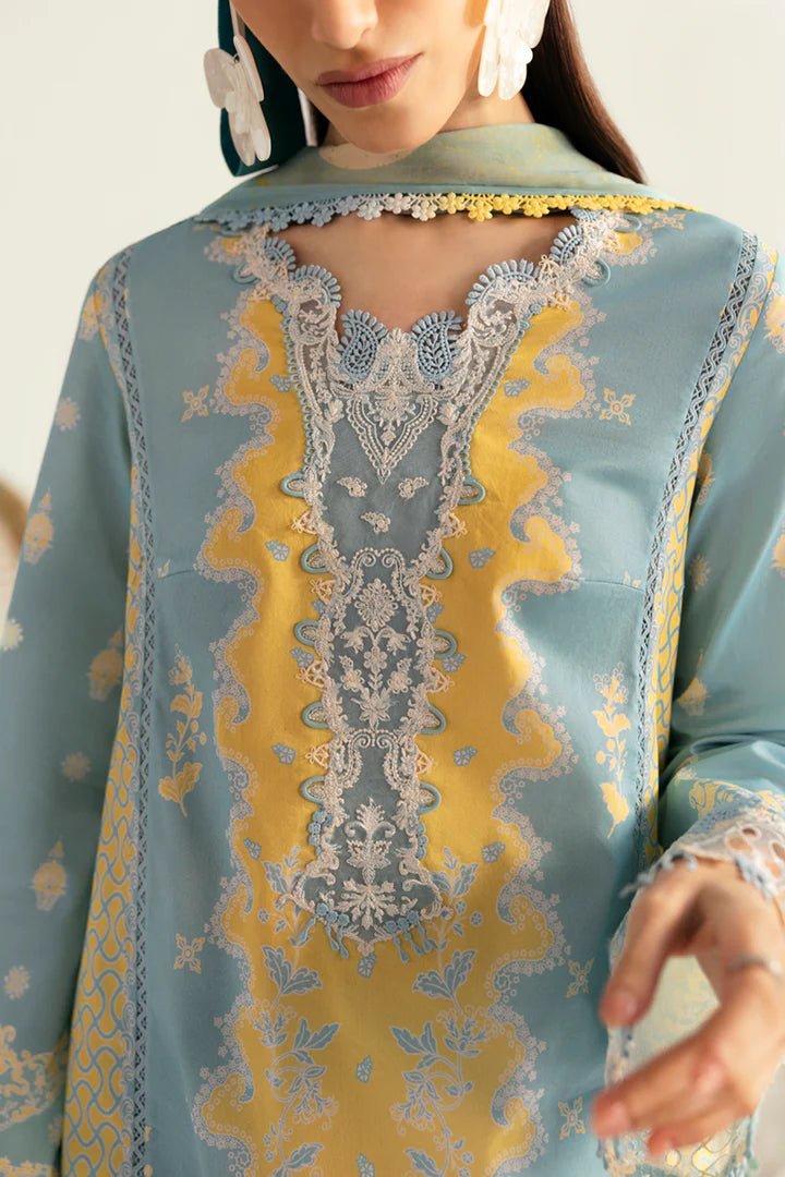 Model wearing blue PQ - 06 Elva dress from Qalamkar, a stylish Pakistani lawn suit perfect for summer clothes and lawn suits in the UK.
