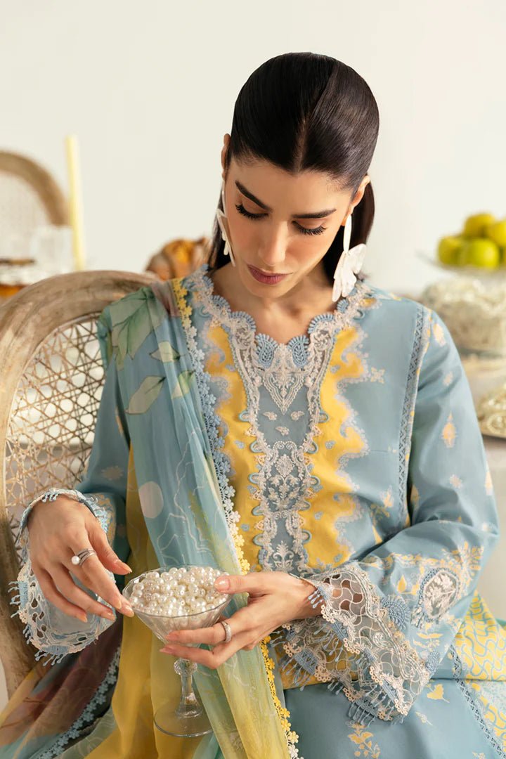 Model wearing blue PQ - 06 Elva dress from Qalamkar, a stylish Pakistani lawn suit perfect for summer clothes and lawn suits in the UK.