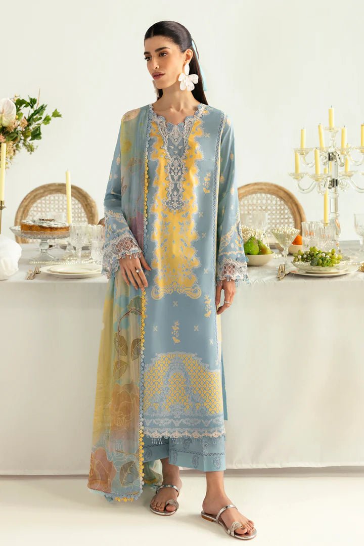 Model wearing blue PQ - 06 Elva dress from Qalamkar, a stylish Pakistani lawn suit perfect for summer clothes and lawn suits in the UK.