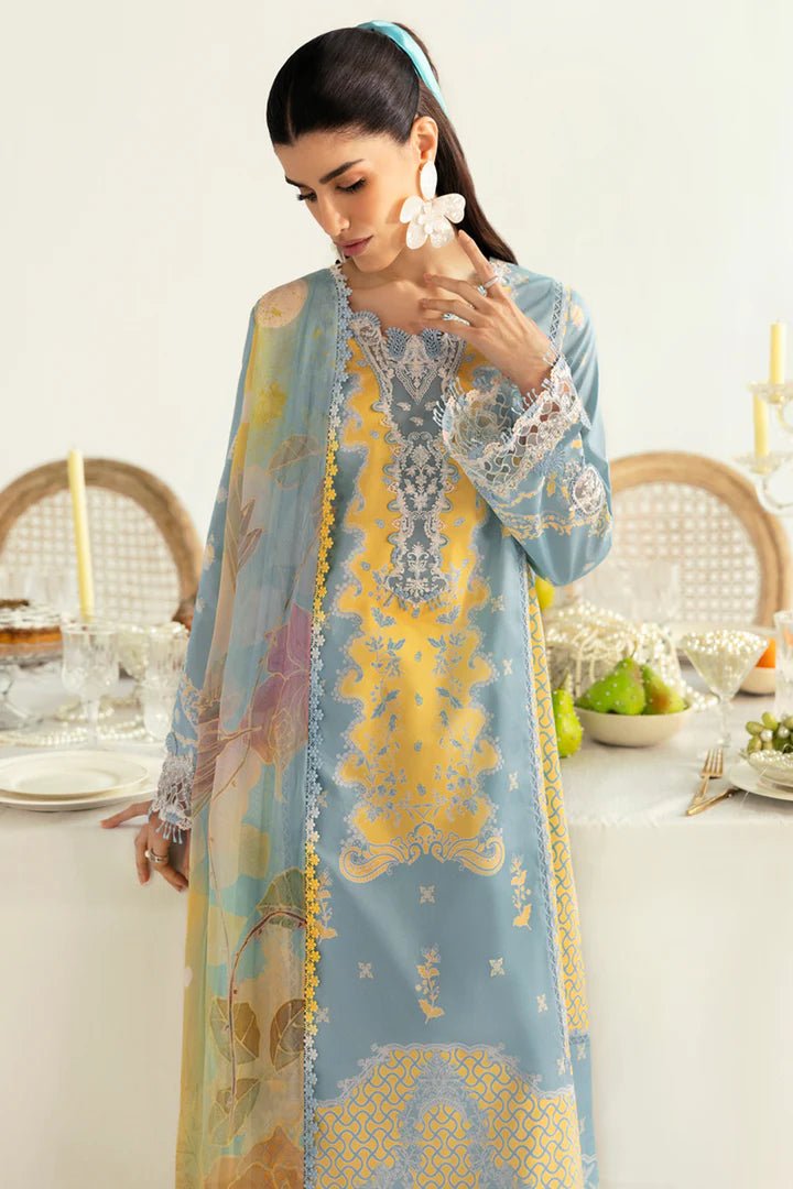 Model wearing blue PQ - 06 Elva dress from Qalamkar, a stylish Pakistani lawn suit perfect for summer clothes and lawn suits in the UK.