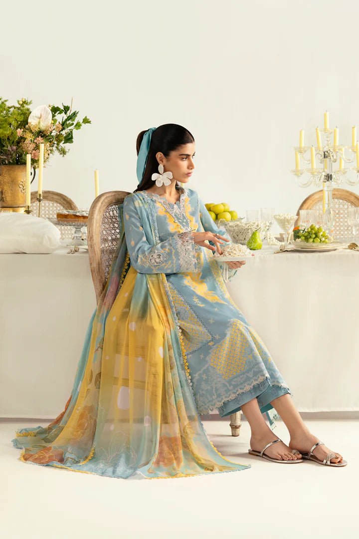 Model wearing blue PQ - 06 Elva dress from Qalamkar, a stylish Pakistani lawn suit perfect for summer clothes and lawn suits in the UK.