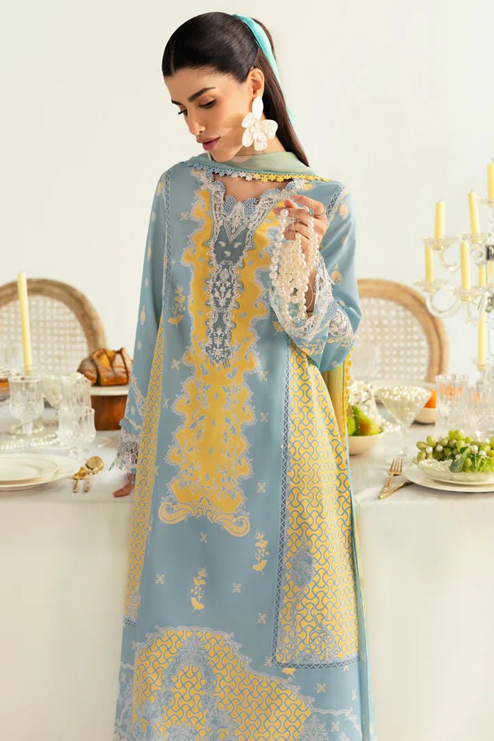 Model wearing blue PQ - 06 Elva dress from Qalamkar, a stylish Pakistani lawn suit perfect for summer clothes and lawn suits in the UK.