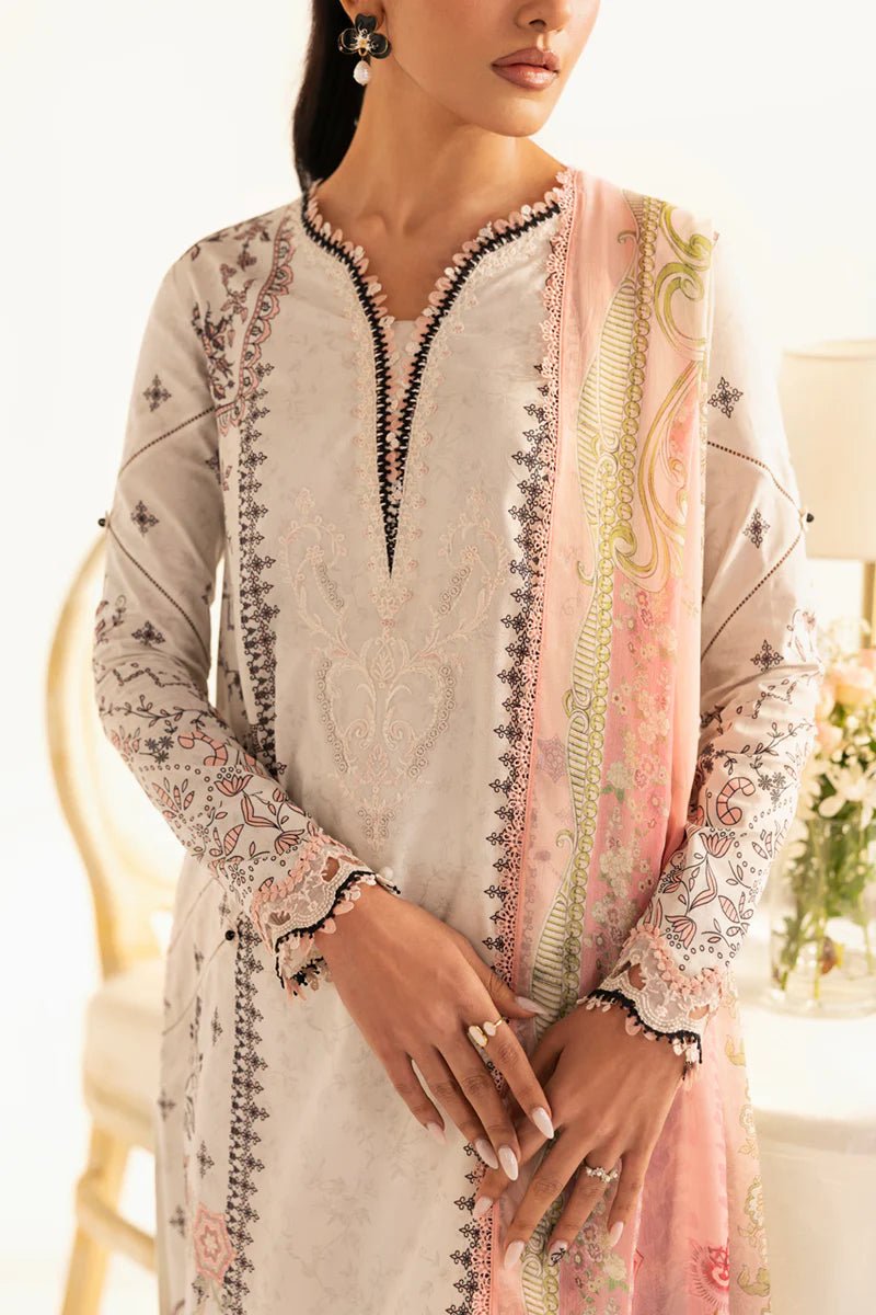 Model wearing Qalamkar Qprints '25 PQ - 09 Lyra dress in white with intricate embroidery and pastel detailing. Shop Pakistani clothes online in the UK now.