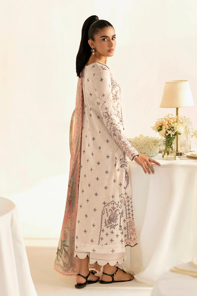 Model wearing Qalamkar Qprints '25 PQ - 09 Lyra dress in white with intricate embroidery and pastel detailing. Shop Pakistani clothes online in the UK now.