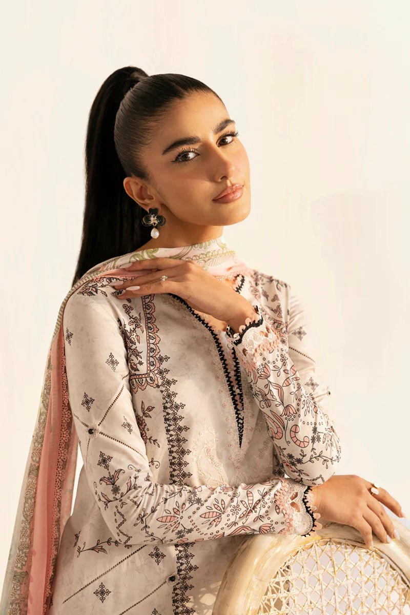 Model wearing Qalamkar Qprints '25 PQ - 09 Lyra dress in white with intricate embroidery and pastel detailing. Shop Pakistani clothes online in the UK now.