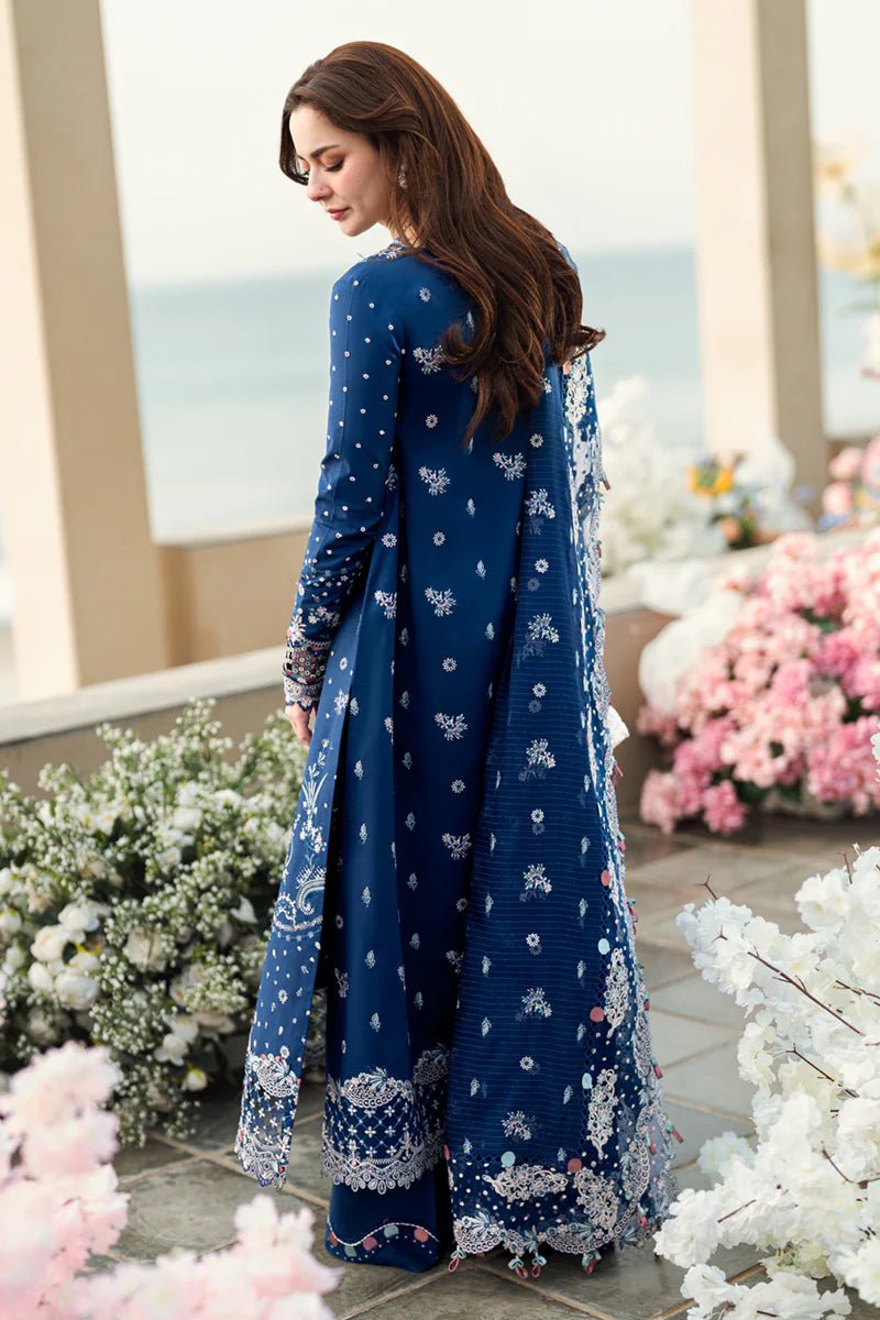 Model wearing Qalamkar Sahil Luxury Lawn '25 FK - 05 AURORA dress in navy blue with intricate embroidery. Shop Pakistani clothes online in the UK now.