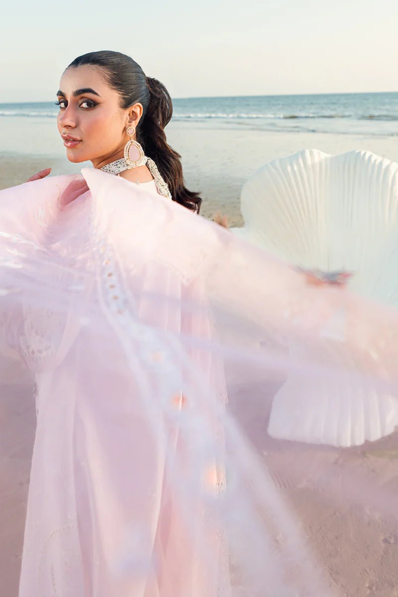 Model wearing Qalamkar Sahil Luxury Lawn '25 FK - 08 REEM dress in pastel pink with delicate embroidery. Shop Pakistani clothes online in the UK now.