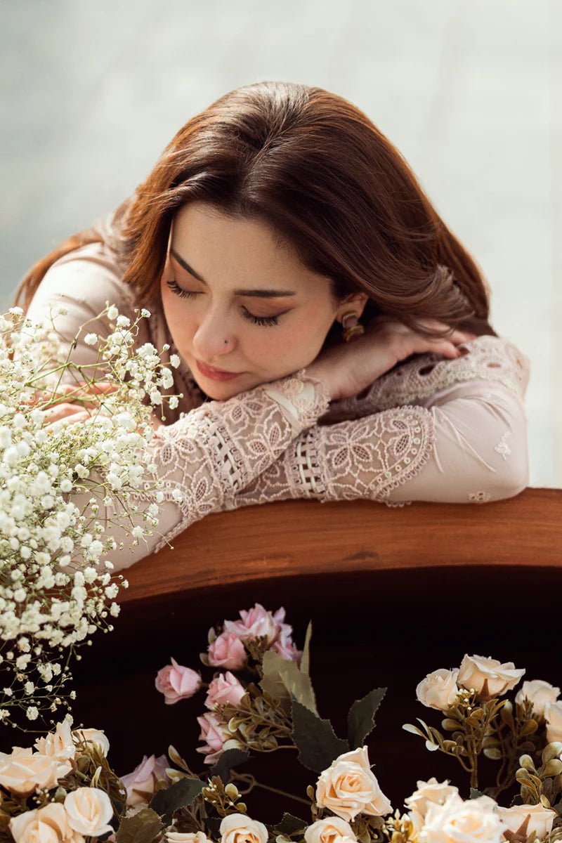 Model wearing Qalamkar Sahil Luxury Lawn '25 FK - 10 ZOE dress in soft pink with intricate embroidery. Shop Pakistani clothes online in the UK now.