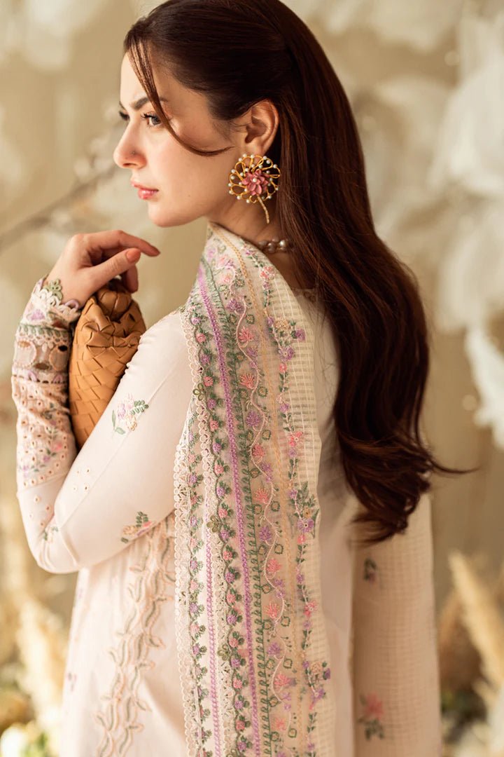 Model wearing pastel pink FK - 12 LILY dress from Qalamkar, a stylish Pakistani lawn suit perfect for summer clothes and lawn suits in the UK.