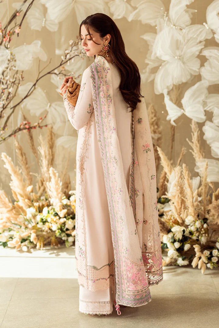 Model wearing pastel pink FK - 12 LILY dress from Qalamkar, a stylish Pakistani lawn suit perfect for summer clothes and lawn suits in the UK.