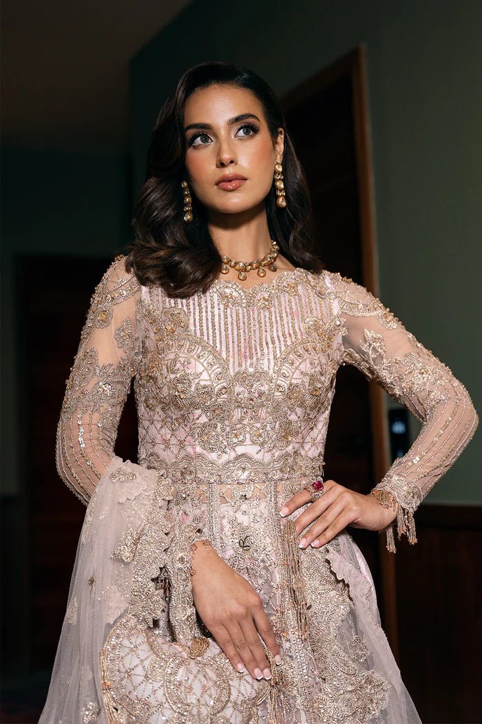 Model wearing RIGEL - SRF - D - 03 from Saira Rizwan's Festive Unstitched collection in vibrant red. Luxury pret, festive, Pakistani clothes online in UK.