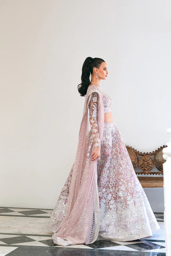 Model wearing a light pink lehenga choli from Saira Rizwan's Naqsh Festive '24 collection, SRN24 - 03 FRANCESCA. Perfect for weddings, this dress is available at Signature Labels Pakistani clothes online in UK.