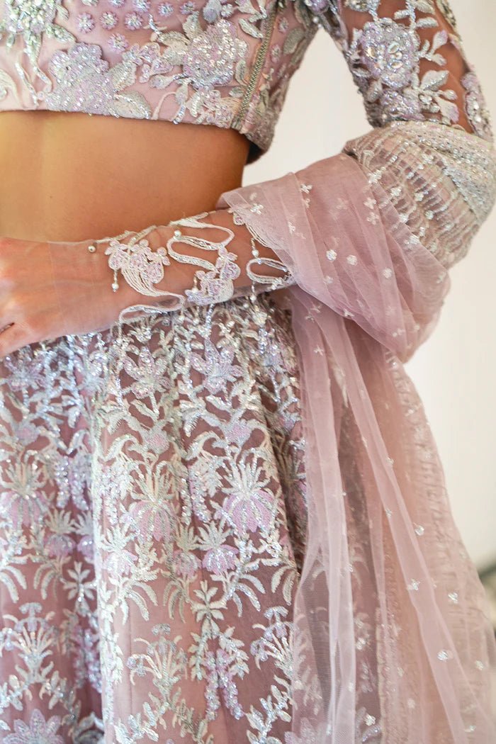 Model wearing a light pink lehenga choli from Saira Rizwan's Naqsh Festive '24 collection, SRN24 - 03 FRANCESCA. Perfect for weddings, this dress is available at Signature Labels Pakistani clothes online in UK.