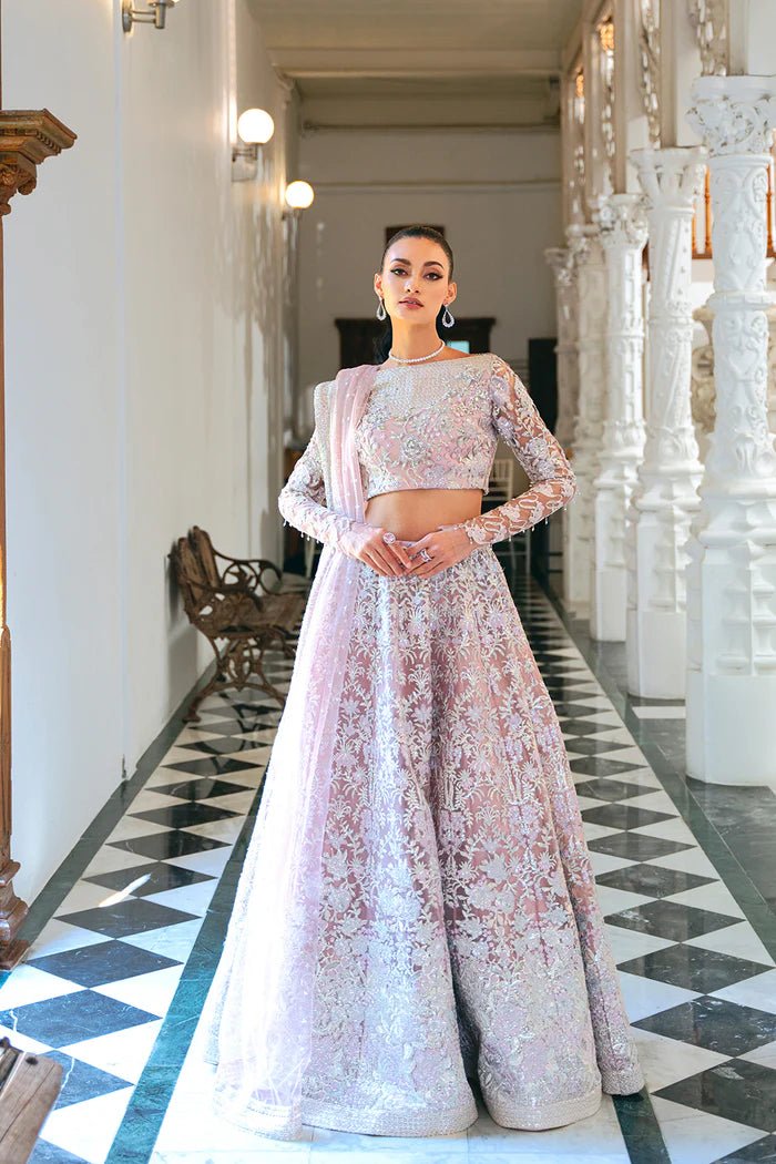 Model wearing a light pink lehenga choli from Saira Rizwan's Naqsh Festive '24 collection, SRN24 - 03 FRANCESCA. Perfect for weddings, this dress is available at Signature Labels Pakistani clothes online in UK.