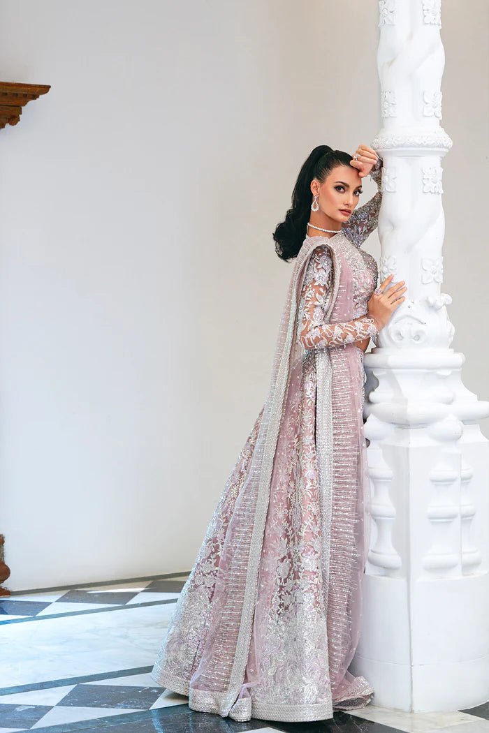 Model wearing a light pink lehenga choli from Saira Rizwan's Naqsh Festive '24 collection, SRN24 - 03 FRANCESCA. Perfect for weddings, this dress is available at Signature Labels Pakistani clothes online in UK.