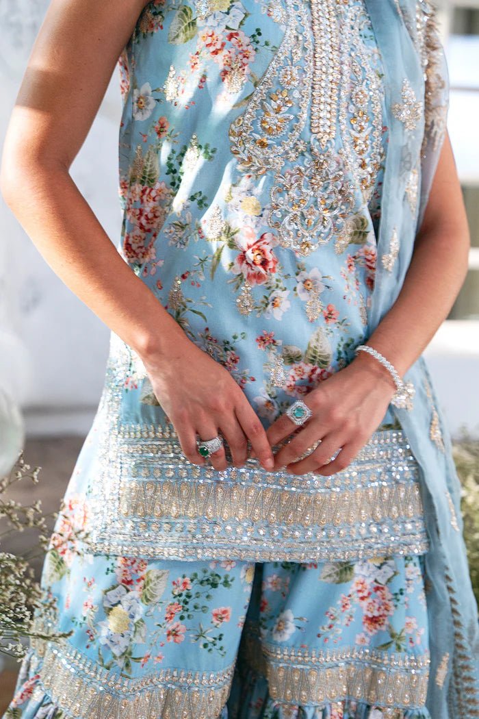 Model wearing SRN24 - 05 EDWINA dress in light blue with intricate floral embroidery from Saira Rizwan, showcasing Pakistani wedding clothes available online in the UK.