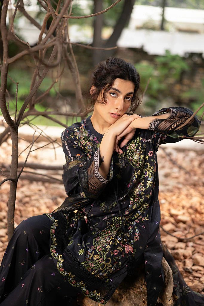 Model wearing black floral embroidered Design 2B from Sobia Nazir's Fall Edit '24 collection. Pakistani winter clothes, casual pret available online in the UK.