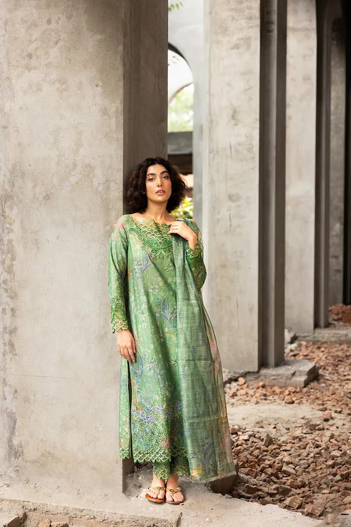 Model wearing green floral embroidered Design 3A from Sobia Nazir's Fall Edit '24 collection. Pakistani winter clothes, casual pret available online in the UK.
