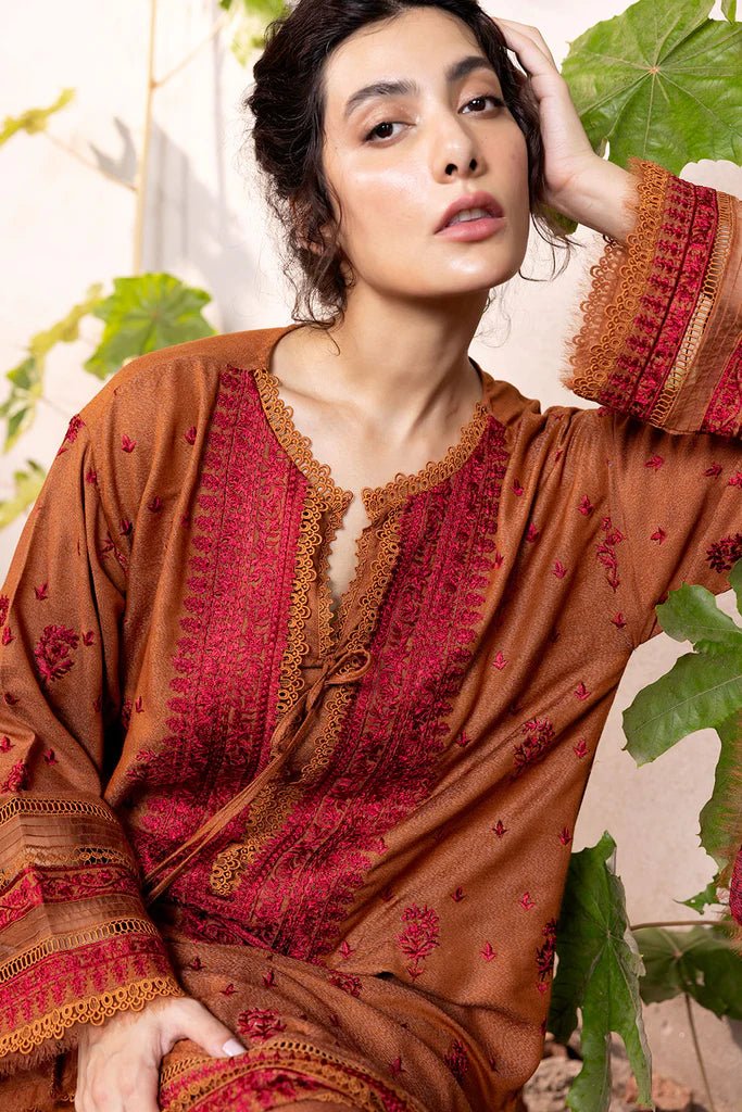 Model wearing Sobia Nazir Fall Edit '24 Design 7A, featuring a brown outfit with intricate embroidery, perfect for winter casual pret. Available online in the UK.