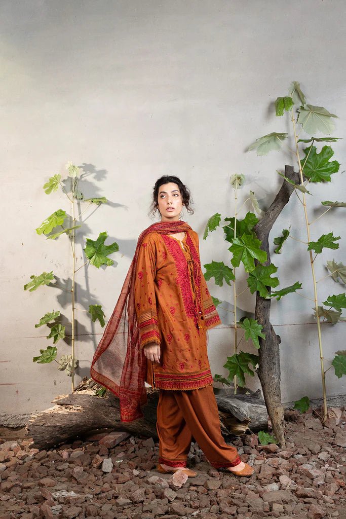 Model wearing Sobia Nazir Fall Edit '24 Design 7A, featuring a brown outfit with intricate embroidery, perfect for winter casual pret. Available online in the UK.