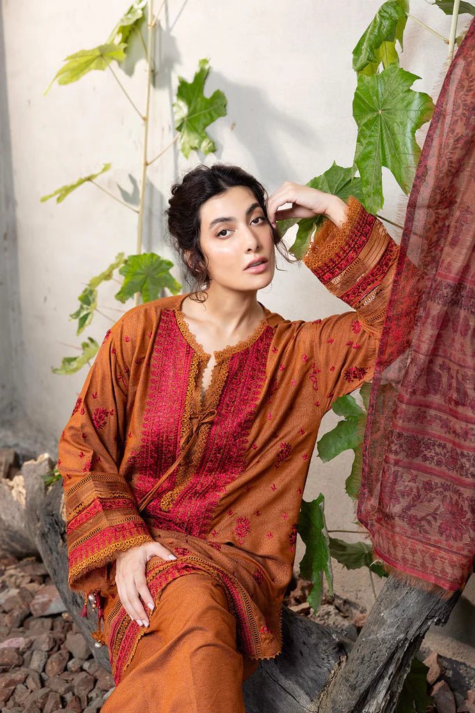 Model wearing Sobia Nazir Fall Edit '24 Design 7A, featuring a brown outfit with intricate embroidery, perfect for winter casual pret. Available online in the UK.