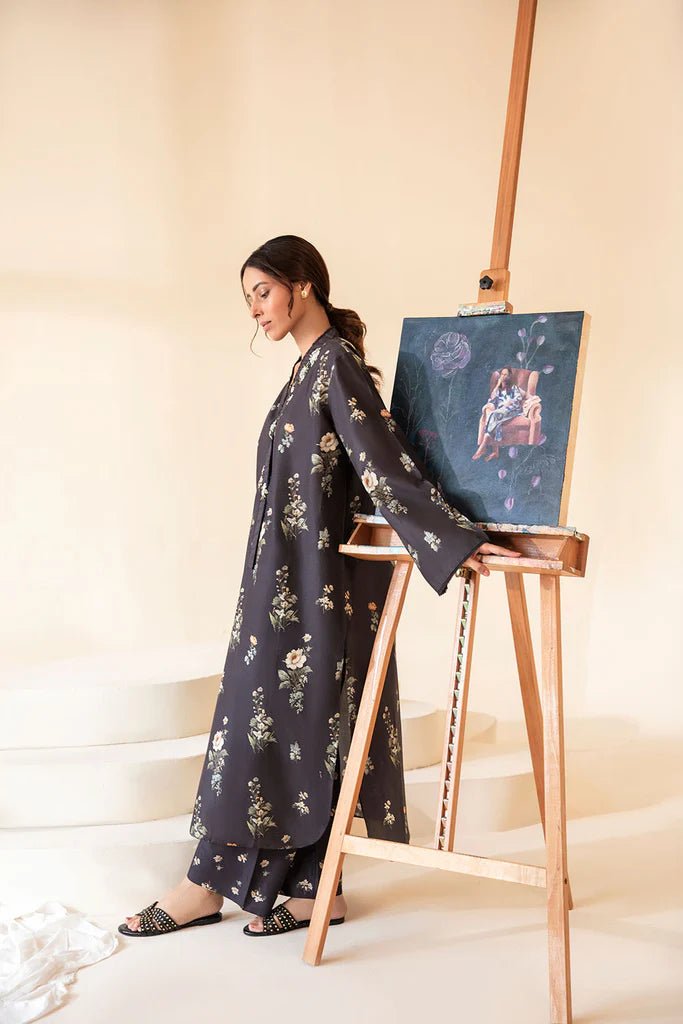 Model wearing Sobia Nazir Fall Edit '24 SNPP - 0321, showcasing a black outfit with detailed embroidery, ideal for winter casual pret. Available online in the UK.