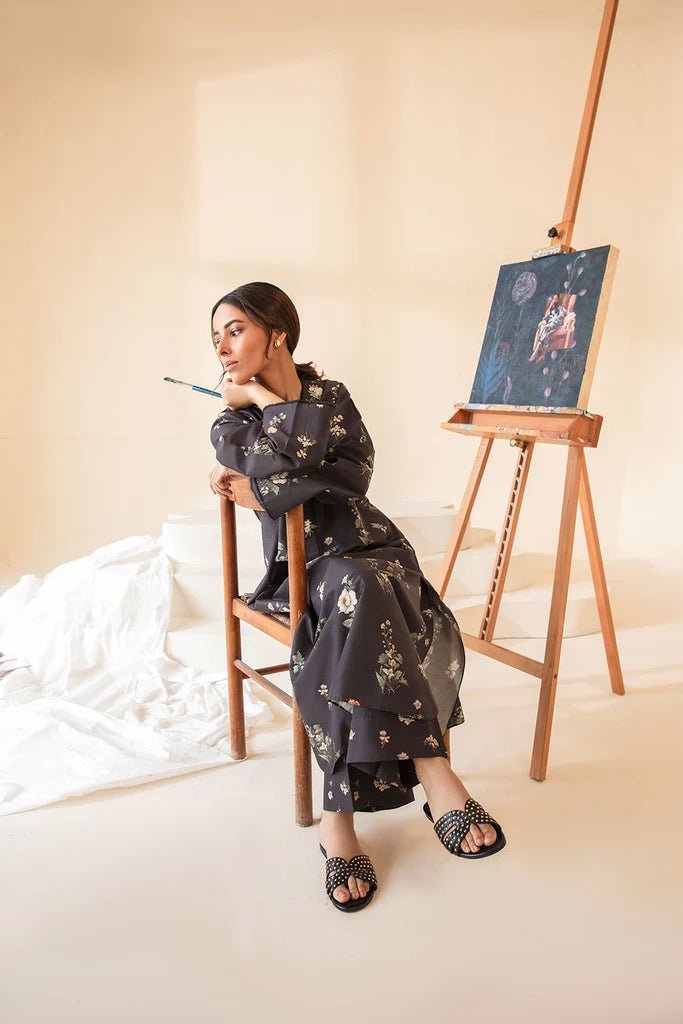 Model wearing Sobia Nazir Fall Edit '24 SNPP - 0321, showcasing a black outfit with detailed embroidery, ideal for winter casual pret. Available online in the UK.