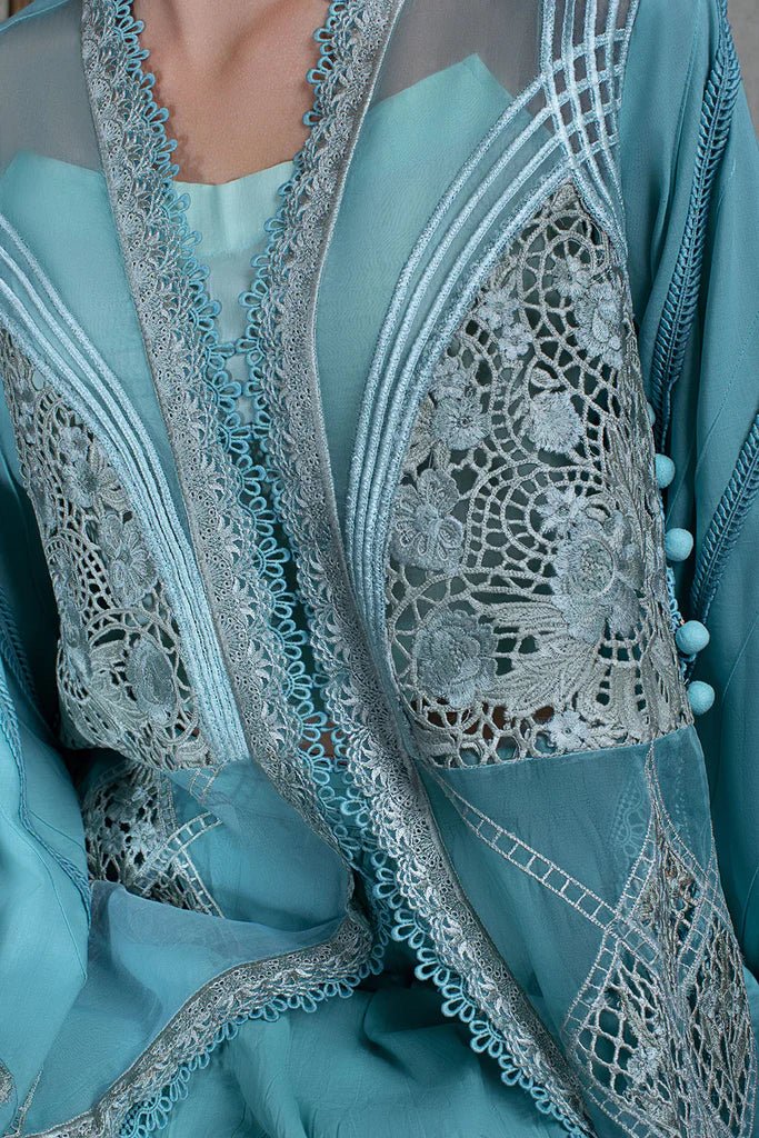 Model in Sobia Nazir DESIGN 10A, an exquisite blue Pakistani lawn dress for the UK.