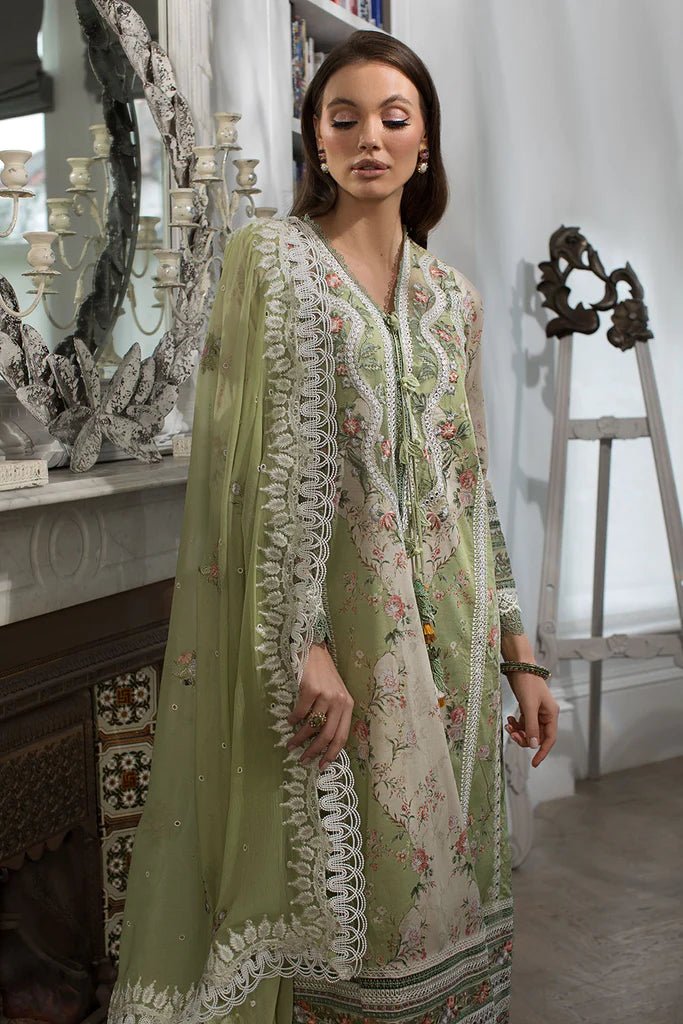 Model in Sobia Nazir DESIGN 14A, a graceful green Pakistani lawn suit, popular in the UK.