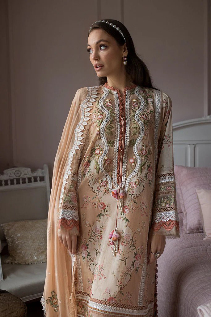 Model contemplates in a Sobia Nazir DESIGN 14B, showcasing Pakistani craftsmanship in the UK.