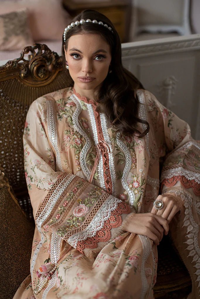 Model contemplates in a Sobia Nazir DESIGN 14B, showcasing Pakistani craftsmanship in the UK.