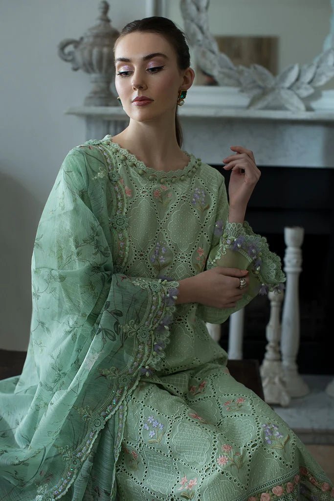 Model in Sobia Nazir DESIGN 2A, a serene green Pakistani lawn dress for the UK market.