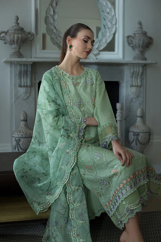 Model in Sobia Nazir DESIGN 2A, a serene green Pakistani lawn dress for the UK market.