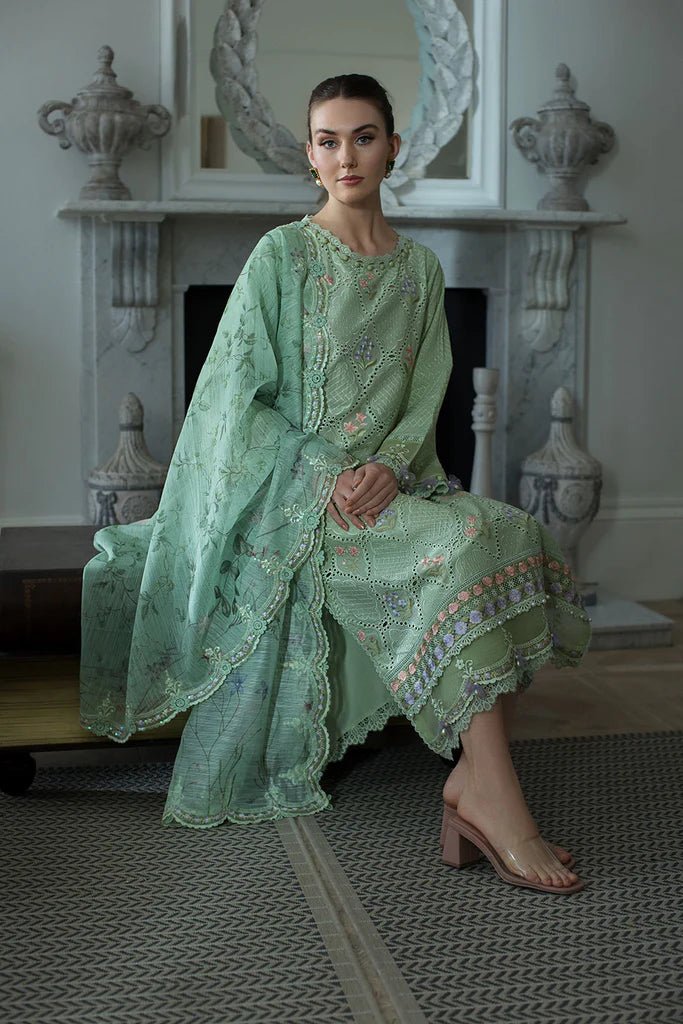 Model in Sobia Nazir DESIGN 2A, a serene green Pakistani lawn dress for the UK market.