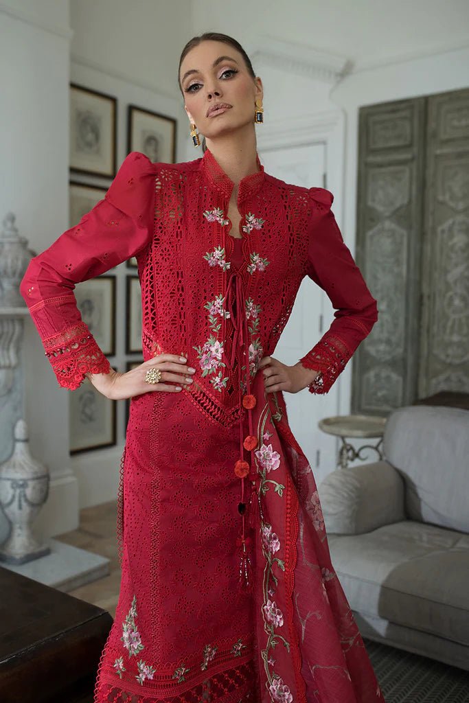 Model in Sobia Nazir DESIGN 3B, chic red Pakistani dress, perfect for UK's trendsetters.