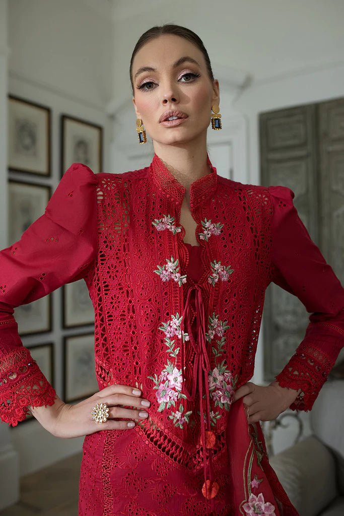 Model in Sobia Nazir DESIGN 3B, chic red Pakistani dress, perfect for UK's trendsetters.