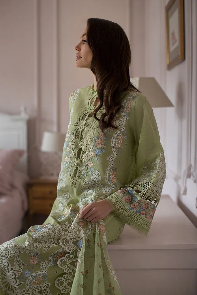Model poses in Sobia Nazir DESIGN 4A, delicate green lawn suit, UK's Pakistani clothing choice.