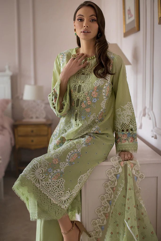 Model poses in Sobia Nazir DESIGN 4A, delicate green lawn suit, UK's Pakistani clothing choice.