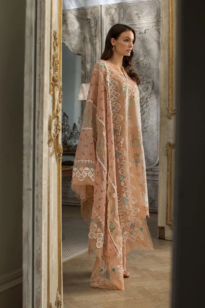 Model in a delicate Sobia Nazir DESIGN 4B lawn dress, showcasing Pakistani elegance in the UK.